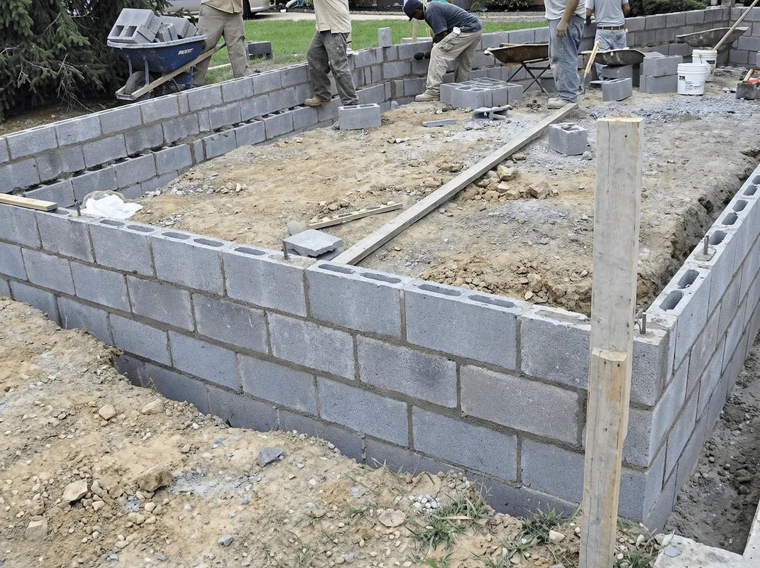 Professionals building a foundation with blocks in Green Bay, WI
