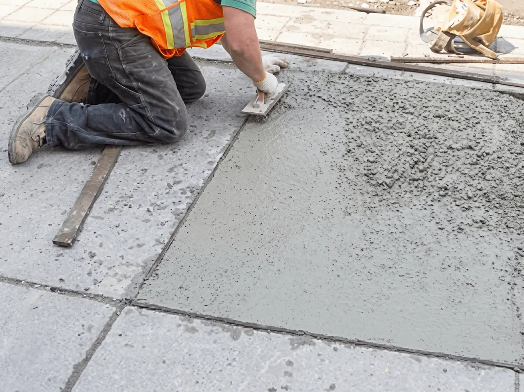 Professional repairing a concrete floor in Green Bay, WI